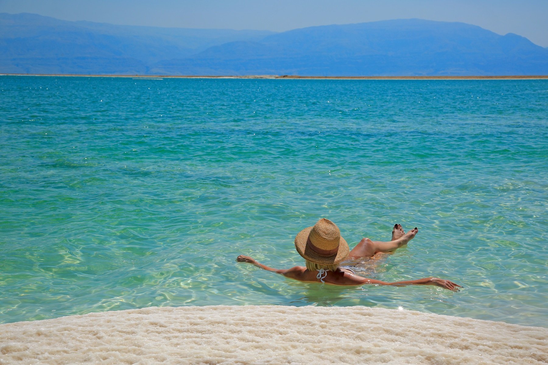 Tourist Floats In The Dead Sea, Israel