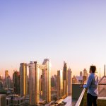 Man Overlooking Dubai Skyline At Sunset