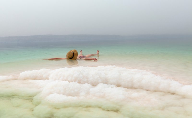 Woman Floating On Dead Sea